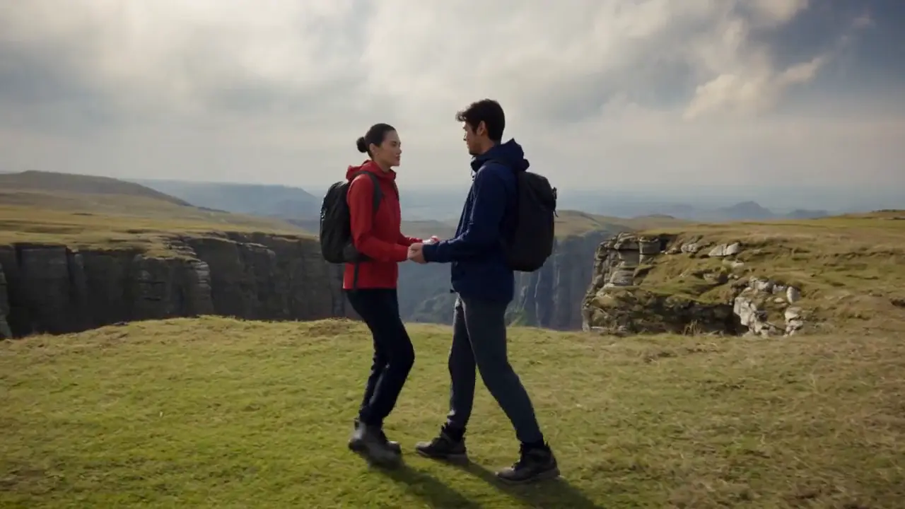 Kling 4 Flash video - two hikers meet and laugh on a grassy clifftop, made from three reference photos