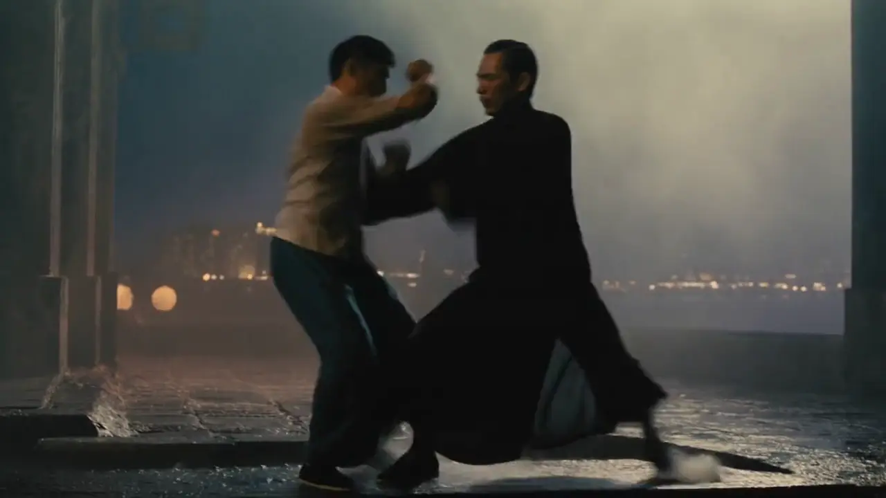 Kling AI video - two kung fu fighters trade blows on a rainy rooftop at night